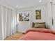 Cozy bedroom with hardwood floors, a large window, and neutral-toned decor at 3256 S Glencoe St, Denver, CO 80222