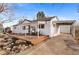 Charming home featuring a front porch with seating and a convenient covered parking area at 3256 S Glencoe St, Denver, CO 80222