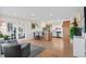 Bright, open-concept kitchen with an island, seating, and stainless steel appliances at 3256 S Glencoe St, Denver, CO 80222