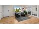 Bright living room with neutral walls, hardwood flooring, and outdoor views at 3256 S Glencoe St, Denver, CO 80222