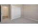 Cozy bedroom featuring neutral carpeting and ample storage with a double-door closet for organizational convenience at 875 E 78Th Ave # 72, Denver, CO 80229