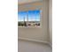 Bedroom with large grid window, carpeted flooring and neutral colored walls at 875 E 78Th Ave # 72, Denver, CO 80229