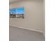 Bedroom with large grid window, carpeted flooring and neutral colored walls at 875 E 78Th Ave # 72, Denver, CO 80229
