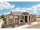 Aerial view of the modern apartment building featuring stone accents and balconies at 875 E 78Th Ave # 72, Denver, CO 80229