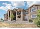 Building exterior showcasing modern architecture, balconies, and landscaping at 875 E 78Th Ave # 72, Denver, CO 80229