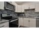 Well-equipped kitchen with stainless steel appliances, granite countertops, and modern cabinetry at 875 E 78Th Ave # 72, Denver, CO 80229