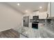 Modern kitchen with stainless steel appliances and granite countertops, ready for cooking at 875 E 78Th Ave # 72, Denver, CO 80229