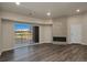 Living room with wood floors, fireplace, and sliding glass doors to the patio at 875 E 78Th Ave # 72, Denver, CO 80229