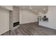 Open-concept living area with fireplace, dining, and kitchen featuring modern finishes at 875 E 78Th Ave # 72, Denver, CO 80229