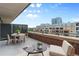 Inviting balcony offers a perfect spot for relaxation with stylish seating and scenic city views at 2100 16Th St # 600, Denver, CO 80202