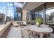 Relaxing balcony area with ample seating and a view of the surrounding city buildings and architectural features at 2100 16Th St # 600, Denver, CO 80202