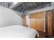 Bedroom showcases warm lighting, hardwood floors, and modern closet doors in the background at 2100 16Th St # 600, Denver, CO 80202