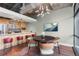 Open-concept living/dining room with modern lighting, and adjacent kitchen with breakfast bar at 2100 16Th St # 600, Denver, CO 80202
