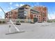 Modern apartment buildings with architectural detailing and an inviting pedestrian walkway at 2100 16Th St # 600, Denver, CO 80202