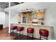 Charming kitchen featuring stainless steel appliances, wood cabinetry, and granite countertops at 2100 16Th St # 600, Denver, CO 80202