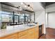 Modern kitchen offering a view of the balcony area and surrounding city at 2100 16Th St # 600, Denver, CO 80202