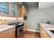 This kitchen features wood cabinets, stainless steel appliances, and granite countertops at 2100 16Th St # 600, Denver, CO 80202