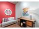 Cozy living room area featuring stylish furniture and modern decor against a bold red accent wall at 2100 16Th St # 600, Denver, CO 80202