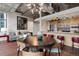 Open-concept living and dining room with modern lighting and adjacent kitchen with breakfast bar at 2100 16Th St # 600, Denver, CO 80202