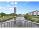Scenic river view from walkway offers scenic overlook with greenery and distant building views at 2100 16Th St # 600, Denver, CO 80202