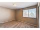 Cozy carpeted bedroom featuring a large window offering ample natural light at 1698 S Kingston St, Aurora, CO 80012