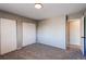 Neutral bedroom with double closets, neutral walls, and plush carpeting at 1698 S Kingston St, Aurora, CO 80012