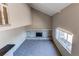 Bright living room with stone fireplace, large window, vaulted ceiling, and neutral carpet at 1698 S Kingston St, Aurora, CO 80012