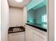 This home has a convenient wet bar with sink and counter space adjacent to the living area at 1698 S Kingston St, Aurora, CO 80012
