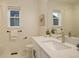 Bright bathroom featuring a single sink, modern fixtures, and window at 16550 Umatilla Pl, Broomfield, CO 80023
