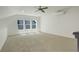 Spacious carpeted room with three windows and bright, natural light at 16550 Umatilla Pl, Broomfield, CO 80023