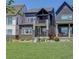Modern home with well-manicured lawn and landscaping at 16550 Umatilla Pl, Broomfield, CO 80023