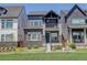 Charming two-story home with stone accents, a covered porch, and a well-maintained lawn at 16550 Umatilla Pl, Broomfield, CO 80023