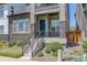 Inviting front porch with stone accents, stylish railings, and landscaped garden at 16550 Umatilla Pl, Broomfield, CO 80023
