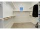 Spacious walk-in closet with built-in shelving and ample storage space at 16550 Umatilla Pl, Broomfield, CO 80023