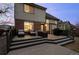 Backyard with tiered wooden deck and outdoor seating, plus a view of the house's exterior at 13096 Birch Dr, Thornton, CO 80241