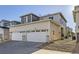 Home exterior showing garages and landscaping at 623 S Pitkin Ct, Aurora, CO 80017