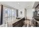 Gourmet kitchen boasts a granite island with bar seating, stainless appliances, and sliding door access at 623 S Pitkin Ct, Aurora, CO 80017