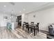 Open floor plan connects the living room and kitchen areas, perfect for entertaining guests at 623 S Pitkin Ct, Aurora, CO 80017