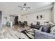 Cozy living room featuring modern decor, a ceiling fan, and an open-concept design at 623 S Pitkin Ct, Aurora, CO 80017