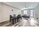 Bright living space features a dining area, comfortable seating, and easy access to the entryway at 623 S Pitkin Ct, Aurora, CO 80017