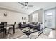 Bright living room boasts contemporary decor, a large sectional sofa, and lots of natural light at 623 S Pitkin Ct, Aurora, CO 80017