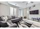 Comfortable living area with a stylish sofa, modern decor, and seamless access to the staircase at 623 S Pitkin Ct, Aurora, CO 80017