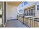 View of the private outdoor patio with black railing at 623 S Pitkin Ct, Aurora, CO 80017