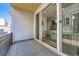 Private patio with large sliding glass doors leading into the home at 623 S Pitkin Ct, Aurora, CO 80017