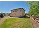 Landscaped backyard with grassy area at 13699 Pecos Loop, Broomfield, CO 80023