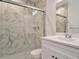 Modern bathroom with marble shower and vanity at 13699 Pecos Loop, Broomfield, CO 80023