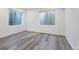 Unfinished basement bedroom with two windows at 13699 Pecos Loop, Broomfield, CO 80023
