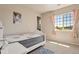 Bright bedroom with a twin bed and window at 13699 Pecos Loop, Broomfield, CO 80023