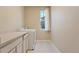 Laundry room with washer, dryer, and cabinets at 13699 Pecos Loop, Broomfield, CO 80023