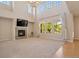 Two-story living room with fireplace and lots of natural light at 13699 Pecos Loop, Broomfield, CO 80023